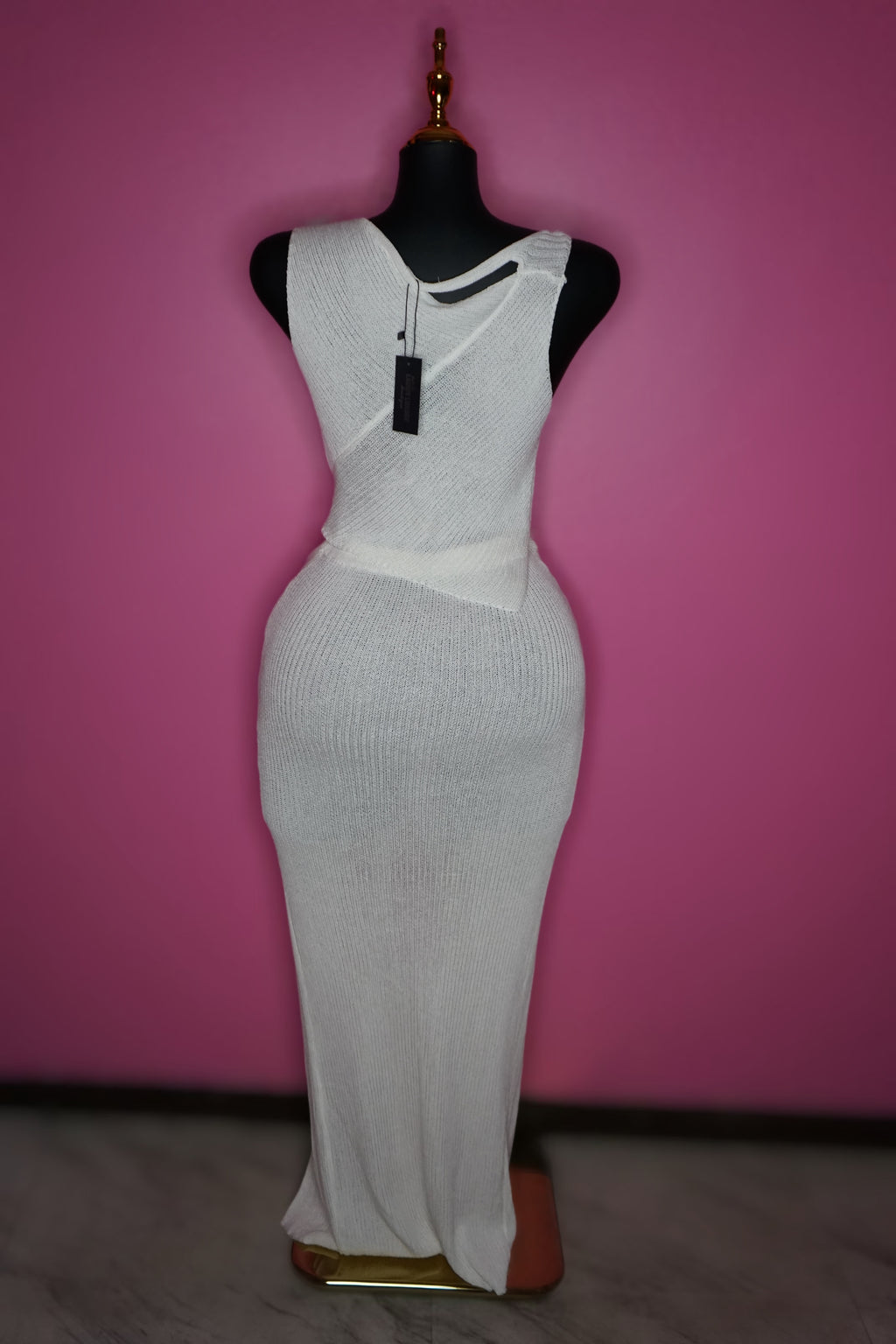 “Tulum” White knit top and skirt set with silver broche embellishments.