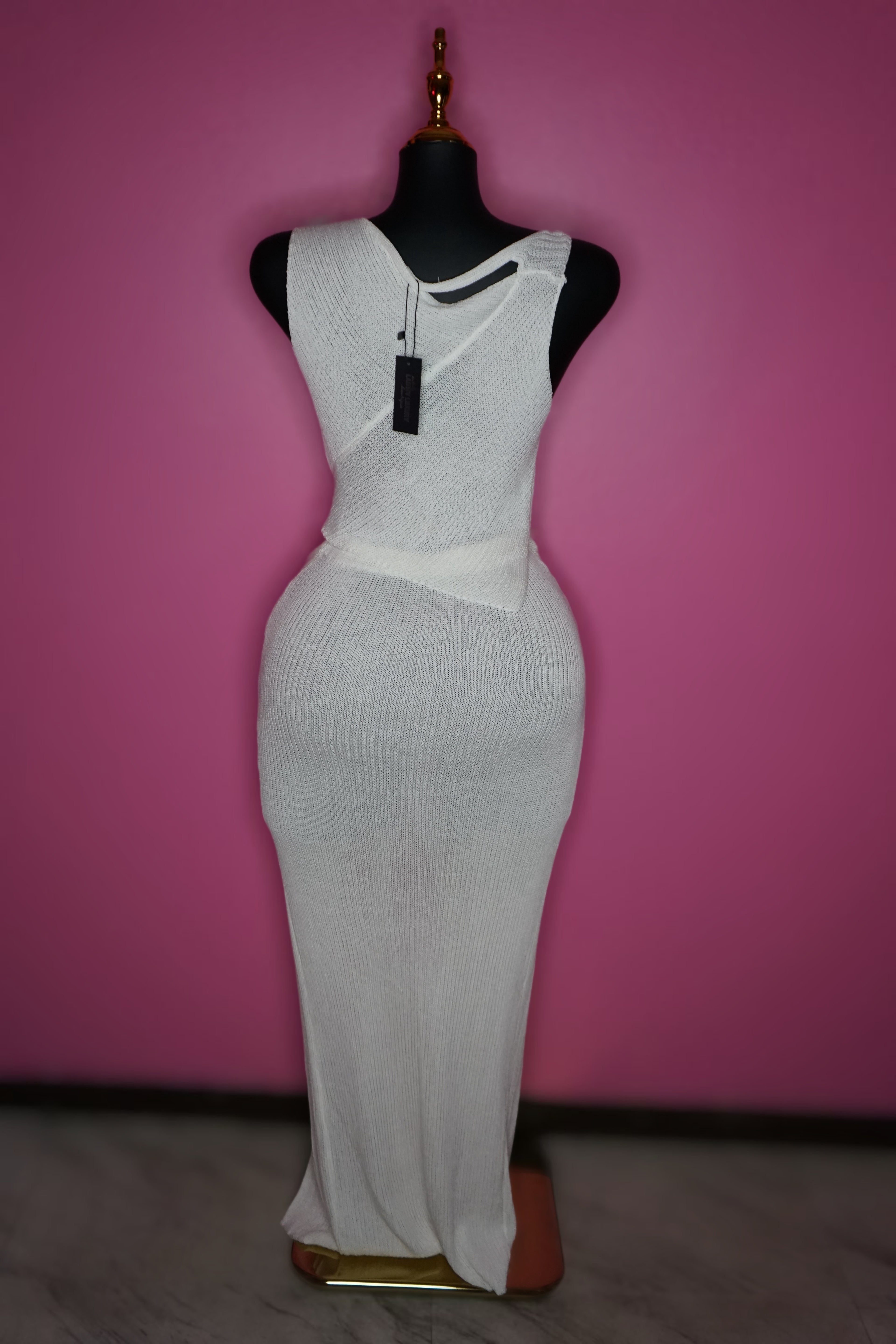 “Tulum” White knit top and skirt set with silver broche embellishments.